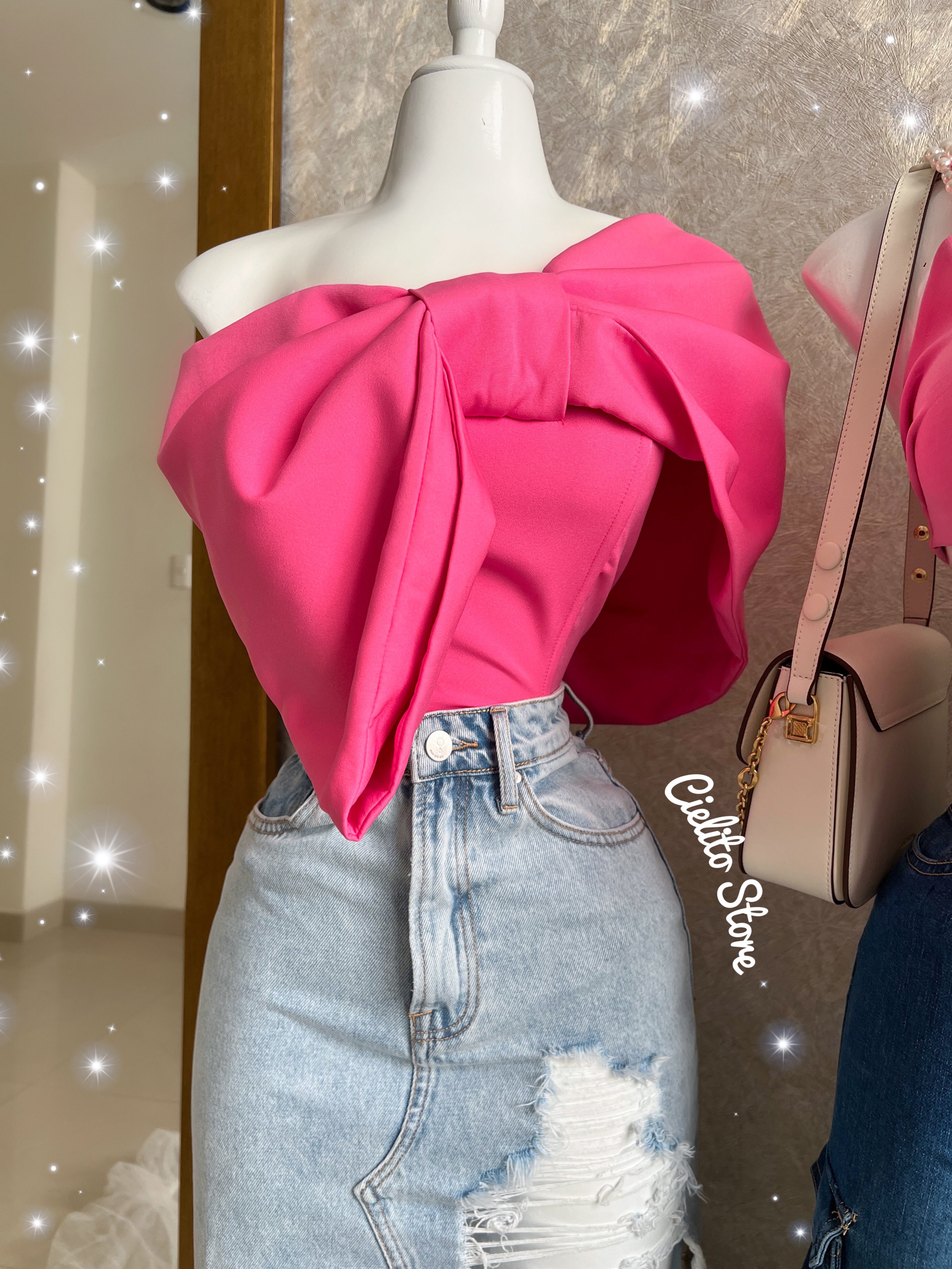 BLUSA ROSA CORTA DE MOÑO