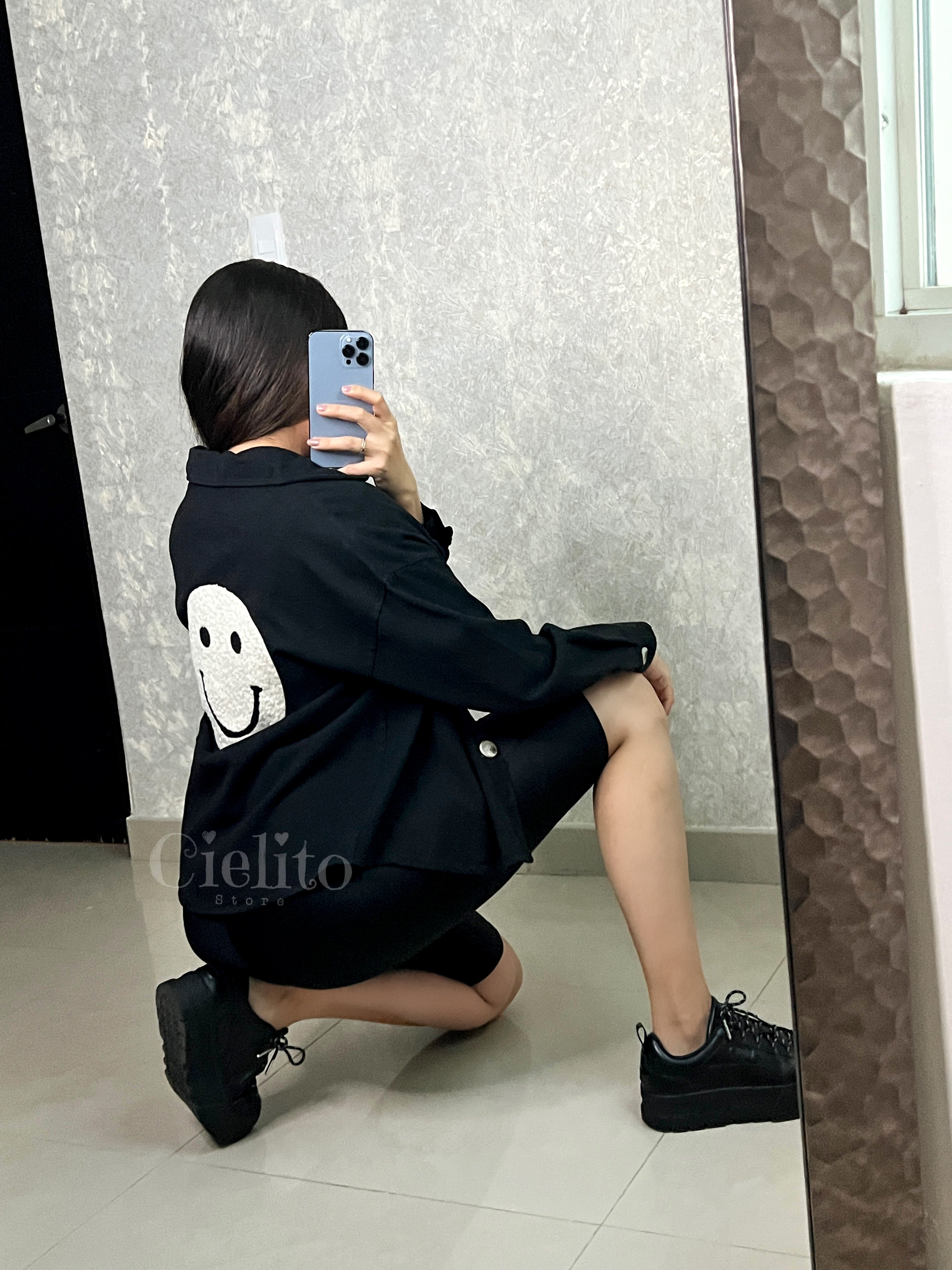 CAMISA NEGRA CON PELUCHITO