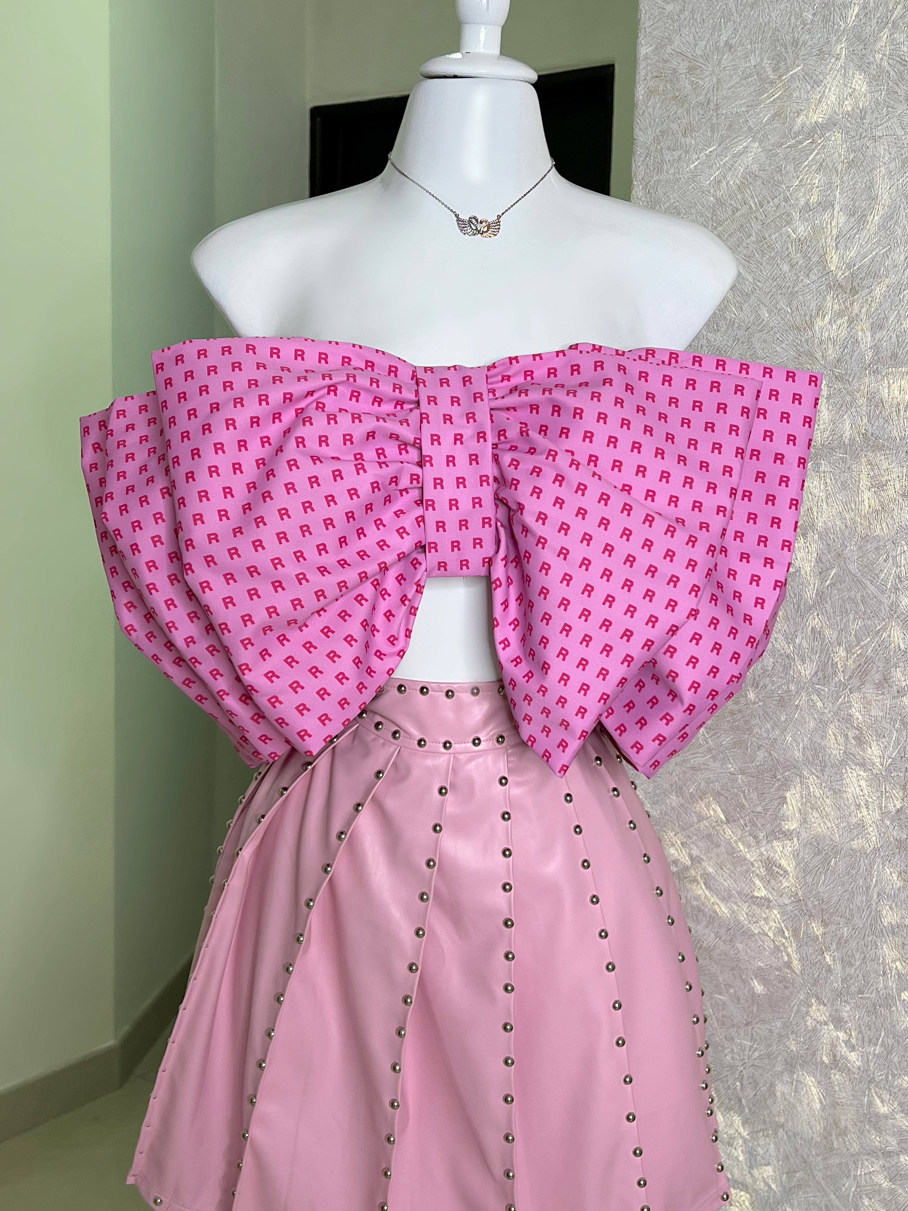 FALDA ROSA VINIPIEL PLISADA