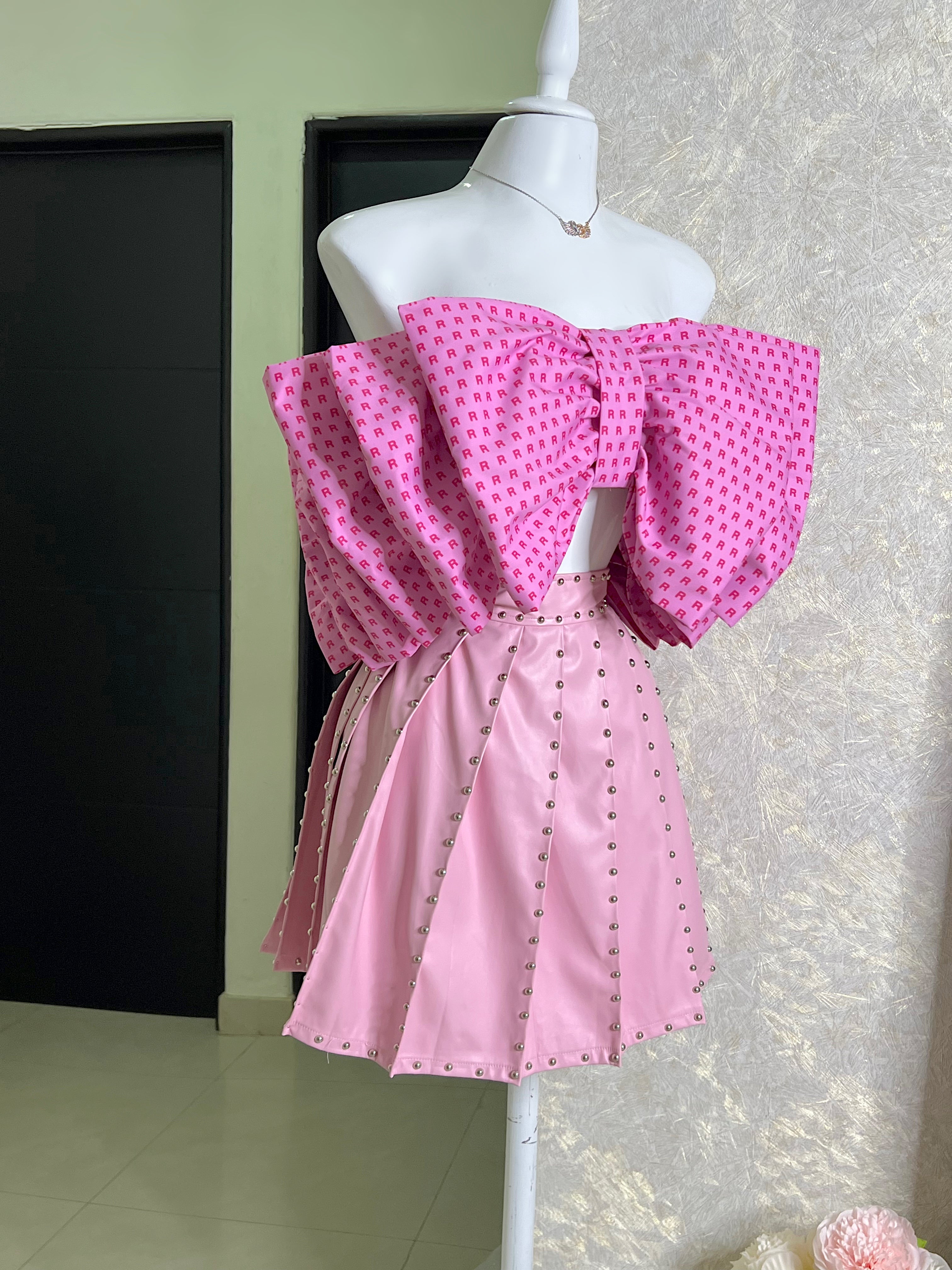 FALDA ROSA VINIPIEL PLISADA