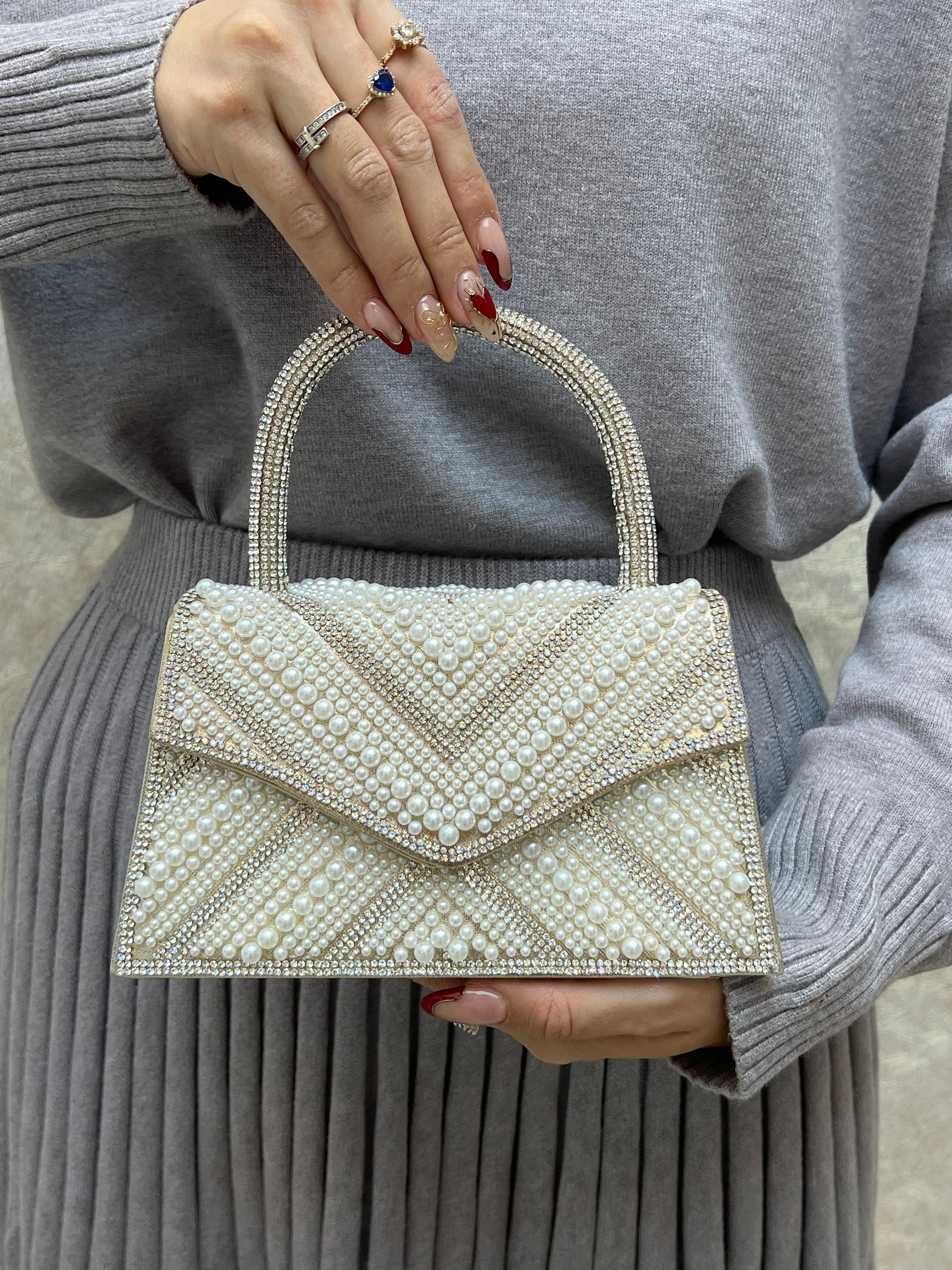BOLSO DORADO CON PERLA