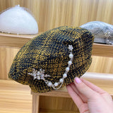 Boina negra con detalle cadenas y piedras